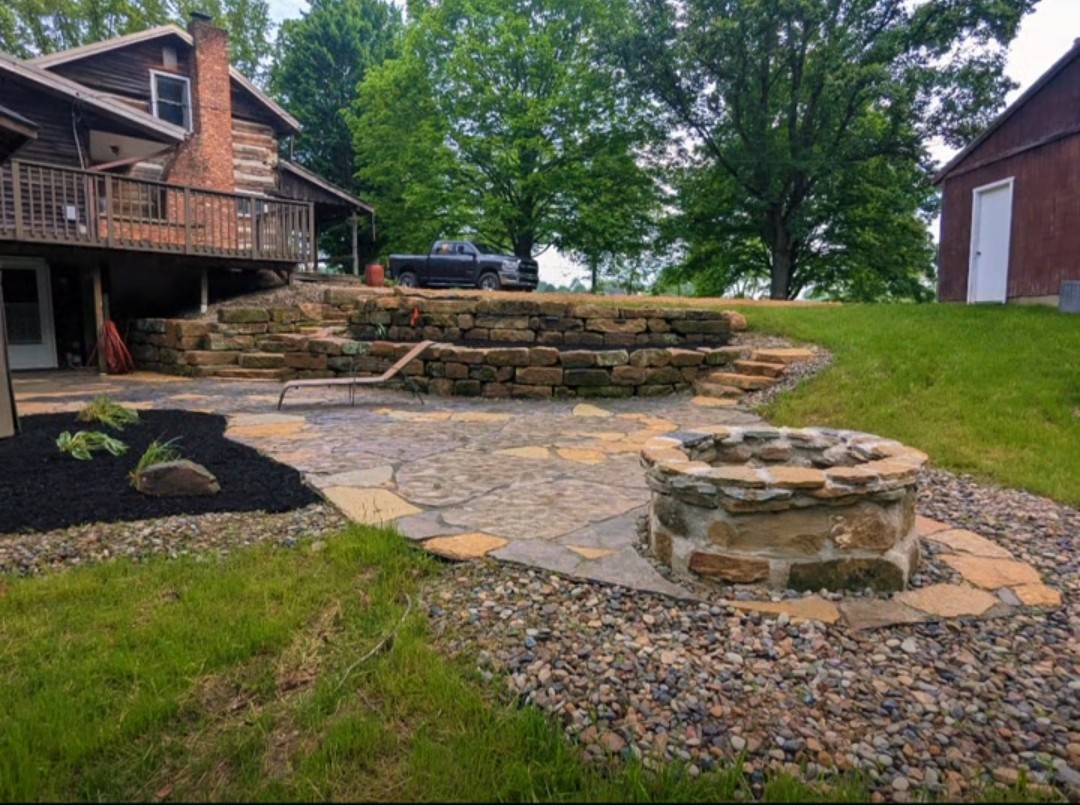 Tiered Barnstone walls and Natural Stone patio with firepit 2